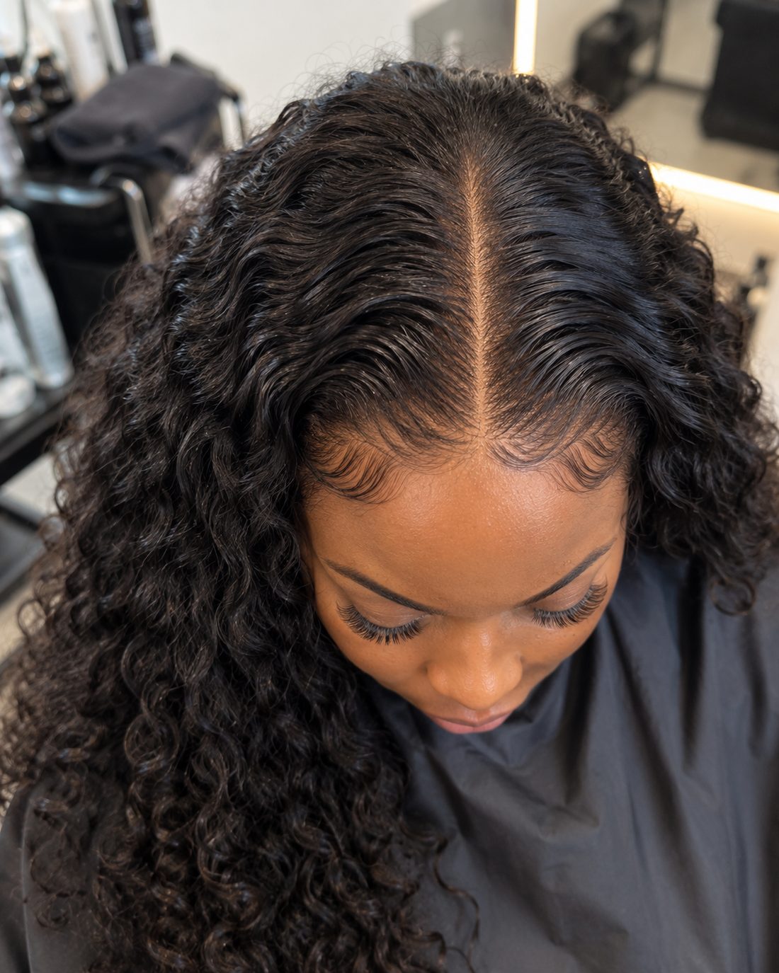 A lace closure with a natural hairline and a crisp middle parting
